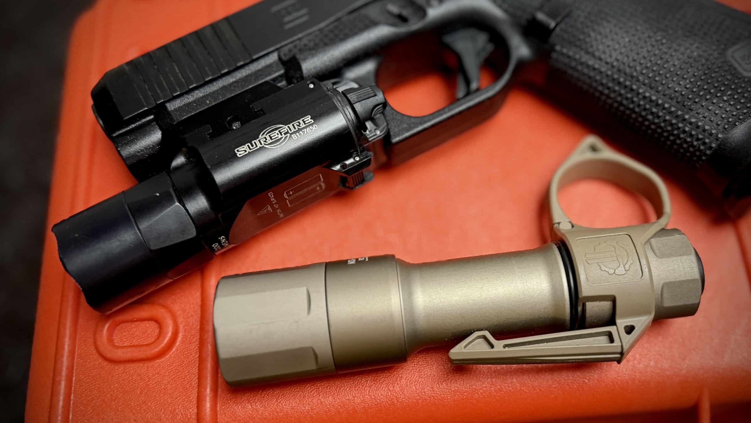 Two flashlights on an orange case.
